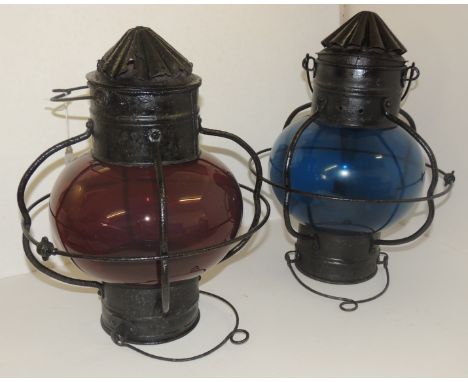 A pair of late 19th Century ship's port and starboard lamps. Iron mounts and suspension loops, one with original fitted oil l