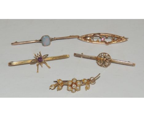 A 9ct gold bar brooch, set with a central winged insect with seed pearl and mauve stone body, a 9ct gold bar brooch set with 