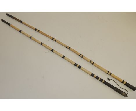 An Indian, sectional, bone and ebony walking stick, with embossed silver metal handle with chain attachment. 83cm long approx