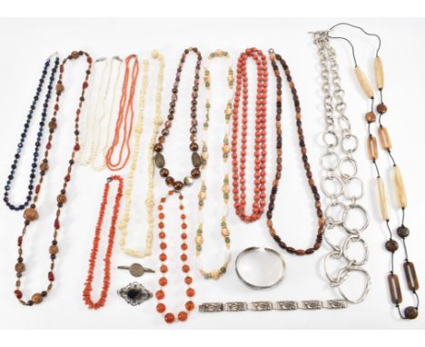 A collection of costume jewellery to include Danish silver bracelet, two coral necklaces, an ivory necklace, 2 cultured pearl