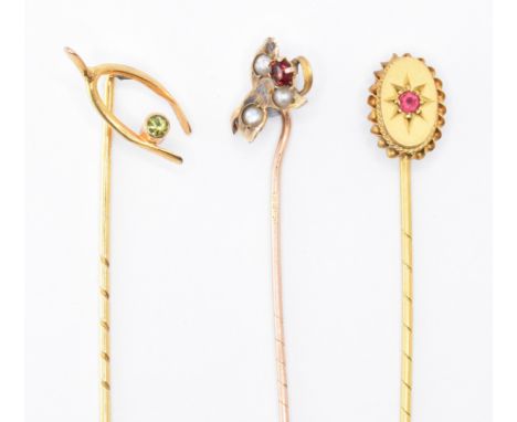 A group of three 19th Century Victorian gold stick pins. The group to include an oval rope twist finial set with a round cut 