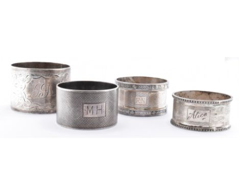 An assortment of silver napkin rings to include an arts and crafts style napkin rings with hammered borders (hallmarked Birmi