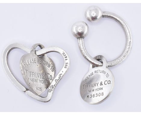 Two Tiffany &amp; Co silver key rings to include one heart shaped key ring with a heart shaped 'please return to' charm (mark