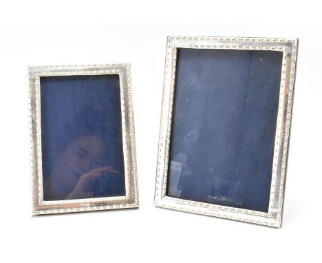 A pair of Highfield frames hallmarked silver matching photo frames. The photo frames having embossed studded decoration and e