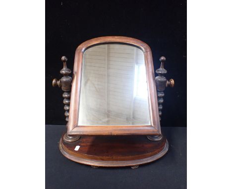 A VICTORIAN MAHOGANY TOILET MIRROR with bobbin supports