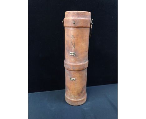 A LEATHER COVERED NAVAL SHELL CARRIER marked with'N' and broad arrow, WWI type 82cm high (general wear)