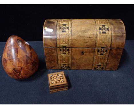 A VICTORIAN PARQUETRY DOMED TOP TEA CADDY (some damage) a Tunbridge Ware style box and a parquetry egg (3)