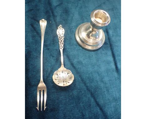 A QUEEN ELIZABETH II SILVER SQUAT CANDLESTICK Maker, WEV silver London 1987 (loaded) 7.5 cm high on a 6.9 cm round base. Edwa