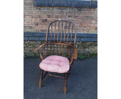 A 19TH CENTURY STAINED ASH AND ELM WINDSOR ARMCHAIR with two tier stick back, wood seat, on turned legs, 91cm high x 59cm wid