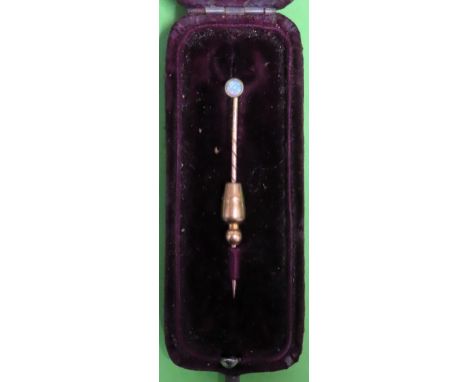 Victorian gold coloured tie pin, set with small opal stone

reasonable used 