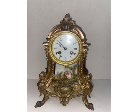 Late 19th century mantle clock, gilt metal with porcelain panel, missing finial and pendulum. 