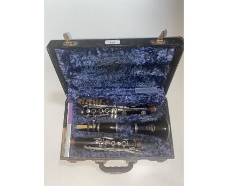 A vintage  clarinet in case, marked 'THE BRITISH HI SPOT BAND INSTRUMENT CORP' 
