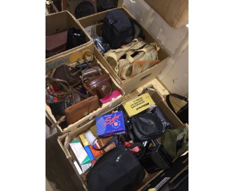 4 boxes containing vintage cameras, camera accessories, camera bags/cases, binoculars and lenses to include a Yashica-Mat Cop