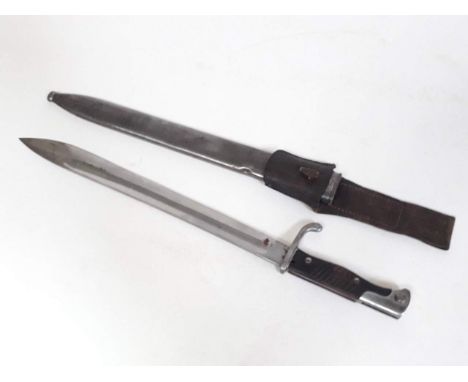 A WWI German butcher bayonet and scabbard. 