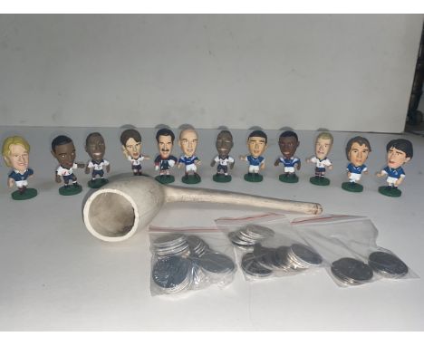 A large football novelty clay pipe, Esso 1970 World Cup tokens and 12 Corinthian miniature England football figures 