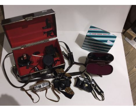 A pair of Carl Zeiss Jena Jenoptem 10 x 50W binoculars unused in case and boxed. A hard camera case/box containing various ca