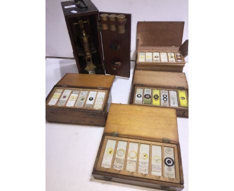 A vintage brass microscope in wodden box with various lenses in brass canisters, R &amp; J Beck Ltd. London 26072 and 4 woode