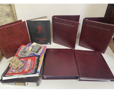 A box containing various stamps, first day covers and a book of historical photos depicting the horrors of war, titled 'Coven