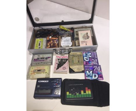 A small case with contents to include a portable Kenwood MD recorder, a portable AGPtEK cassette to MP3 converter, usb sticks
