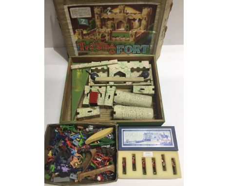 A Tri-ang fort, a boxed set of six Ducal military figures and a box of various vintage plastic toy soldiers. 