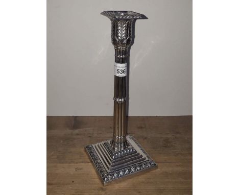 A Victorian silver candlestick of Gothic column form with acanthus capitol and stepped base, William Hutton &amp; Sons (Edwar