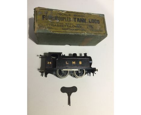 A boxed Bassett-Lowke Ltd Four Coupled Tank Loco clockwork 0 gauge model engine. 