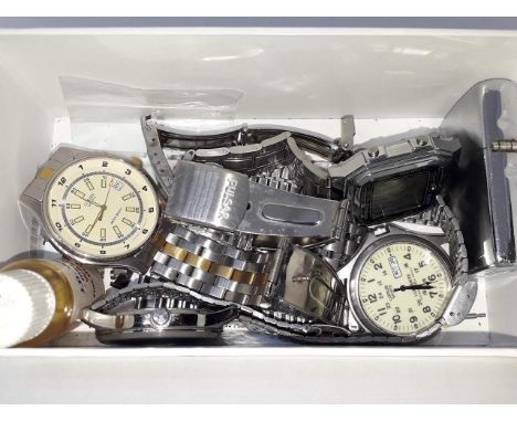 Four assorted wristwatches together with a Zippo lighter and a Ronson table lighter (boxed), together with assorted watch str