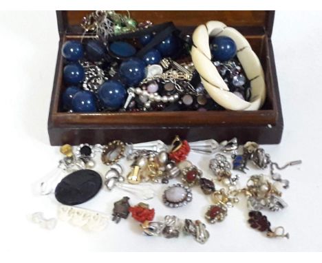 A box of vintage costume jewellery jewellery including an early 20th century yellow metal wire bound carved ivory bangle, ear