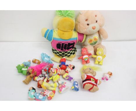 Collection of Circa 80's soft toys and figurines to include Care Bears, Troll Dolls, Ed the Duck and Cabbage Patch Dolls (26)