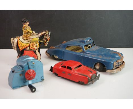 Four tin plate models to include Arnold Candidat friction powered car, drummer on horseback (made in GB), Lone Star Roll Tick