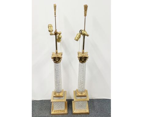 An impressive large pair of gilt bronze and cut crystal column table lamps, overall H. 100cm.