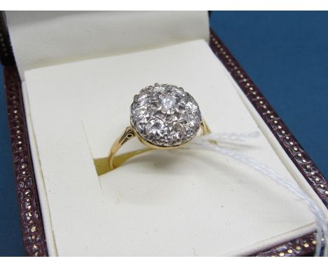 A Nine Stone Diamond Cluster Ring, set throughout with brilliant cut stones, stamped "18ct" "Plat".