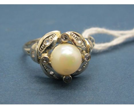 A Pearl Set Dress Ring, with collet set highlights, stamped. 