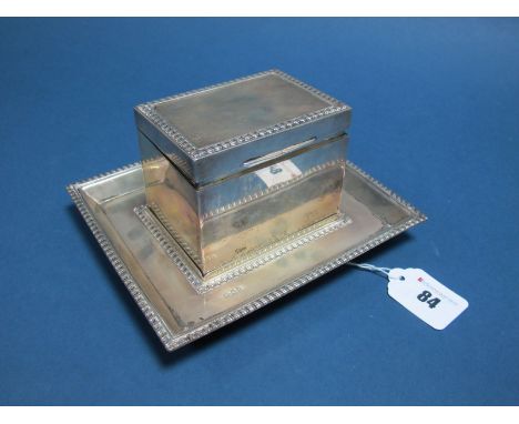 A Hallmarked Silver Caddy/Box, George Kenning & Son, London 1921, of plain rectangular form with gadrooned detail, on matchin