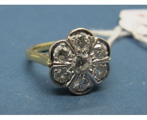 A Modern 18ct Gold Seven Stone Diamond Set Cluster Ring, of flowerhead design, set throughout with old cut stones. 