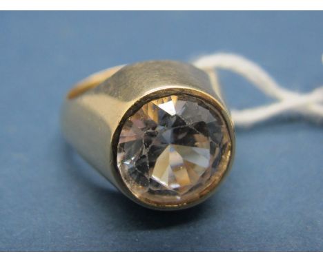 A Single Stone Dress Ring, circular collet rubover set, high between plain shoulders. 