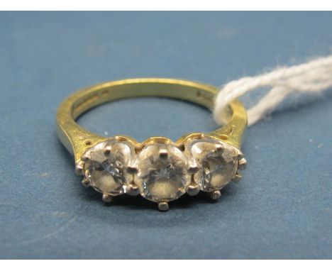 An 18ct Gold Three Stone Diamond Ring, claw set with brilliant cut stones, stamped "1.00 Dia". 