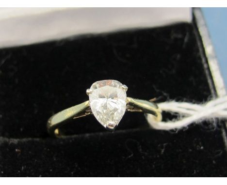 An 18ct Gold Pear Shape Single Stone Diamond Ring, the (7mm long) stone claw set. 