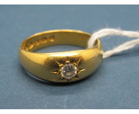 A 22ct Gold Ring, star set to the front with a single stone. 