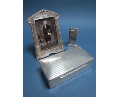 A Hallmarked Silver Cigarette Box, (marks rubbed) of rectangular form, the hinged lid engine turned and initialled, inscribed