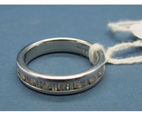 A Modern 14ct White Gold Diamond Set Half Eternity Style Ring, alternately set with brilliant and baguette cut stones. 