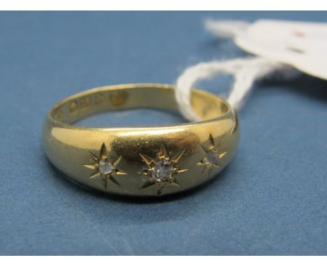 An 18ct Gold Three Stone Ring, graduated star set.