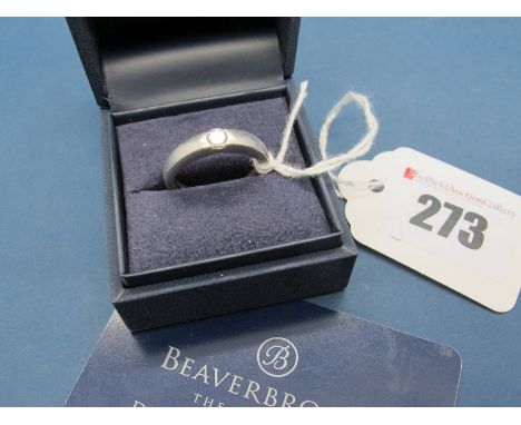 A Modern Platinum Single Stone Diamond Ring, the brilliant cut stone semi rubover set, between plain shoulders. *Beaverbrooks