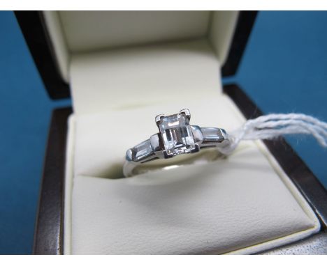 A Platinum Millennium Cut Single Stone Diamond Ring, corner claw set, between diamond set shoulers, stamped "1.01". 