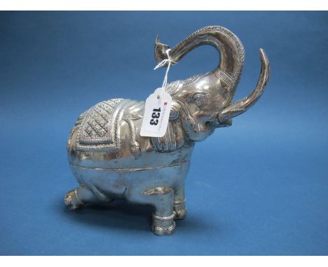 A Cambodian Elephant Betel Box, allover detailed in relief, with raised trunk and kneeling hind legs, overall height 21.3cms,