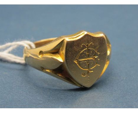 An 18ct Gold Gent's Signet Ring, the shield shape panel initialled "JE". 