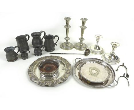 A group of silver plated items, including two pairs of candlesticks, wine coasters, three trays, toddy ladle with baleen twis