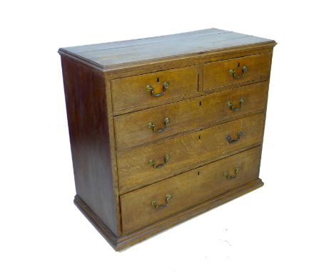 A George III oak chest of two short over three long graduating drawers, with cock beading and brass swan neck handles, a/f mi