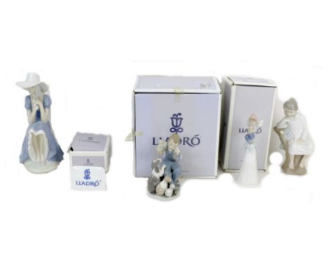 A group of Lladro porcelain figures, comprising 'Puppet Show', 5736, 15cm high, boxed, 'Thinker Little Boy', 4876, signed and