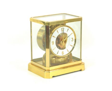A Jaeger LeCoultre Atmos clock, circa 1960s, with circular enamel Arabic dial, brass mounted glazed case, serial number '3522